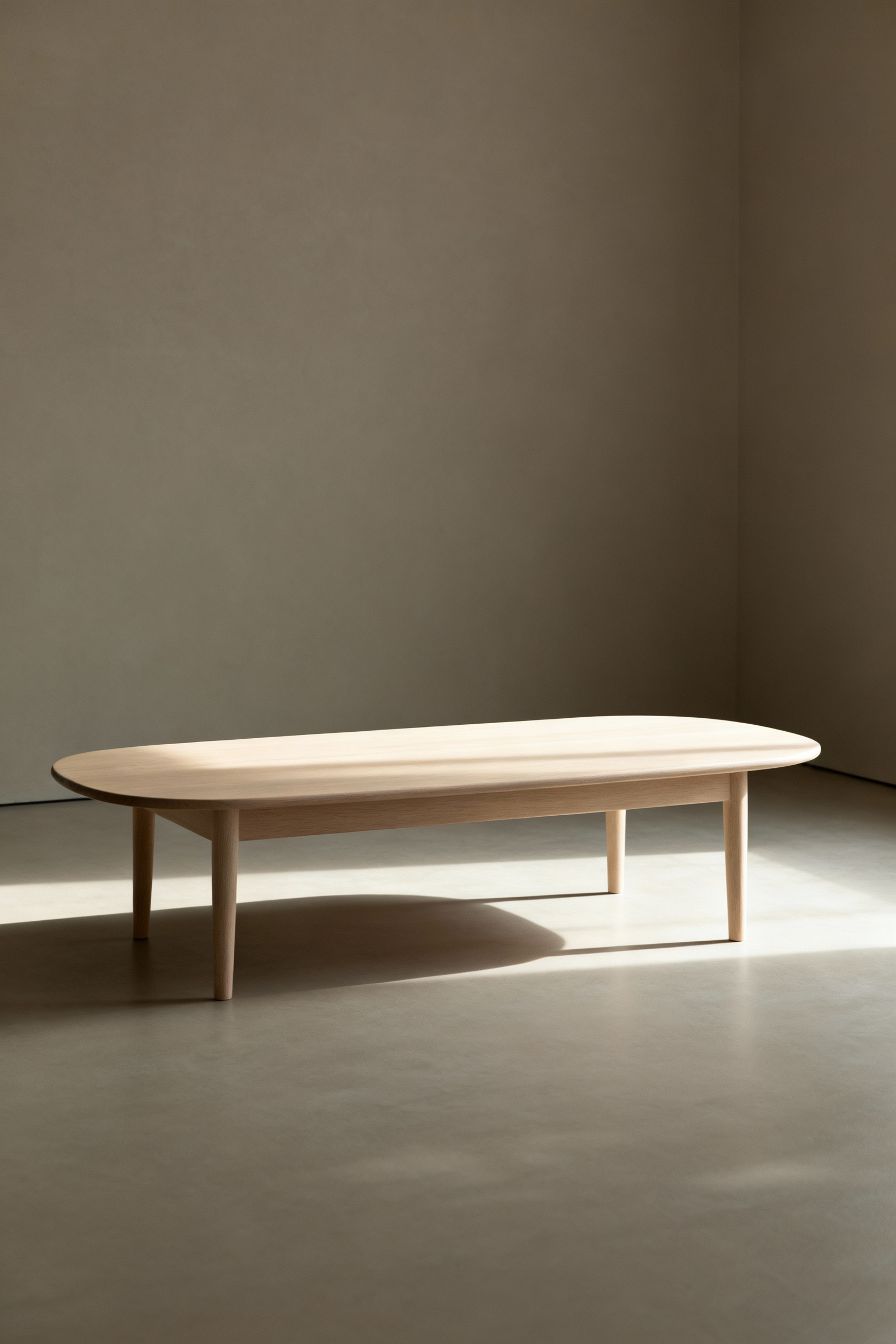 A minimalist Nordic coffee table made of light wood with subtle, clean lines, showcased in a serene living room with soft natural lighting, embodying visual quietude.