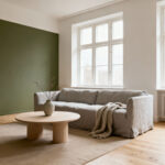 A tranquil Scandinavian living room embodying Lagom's 'just enough' philosophy, featuring a comfortable linen sofa, a simple wooden coffee table, and natural light. The uncluttered space showcases a harmonious balance of form and function with natural materials and an earthy color palette, creating a serene environment.