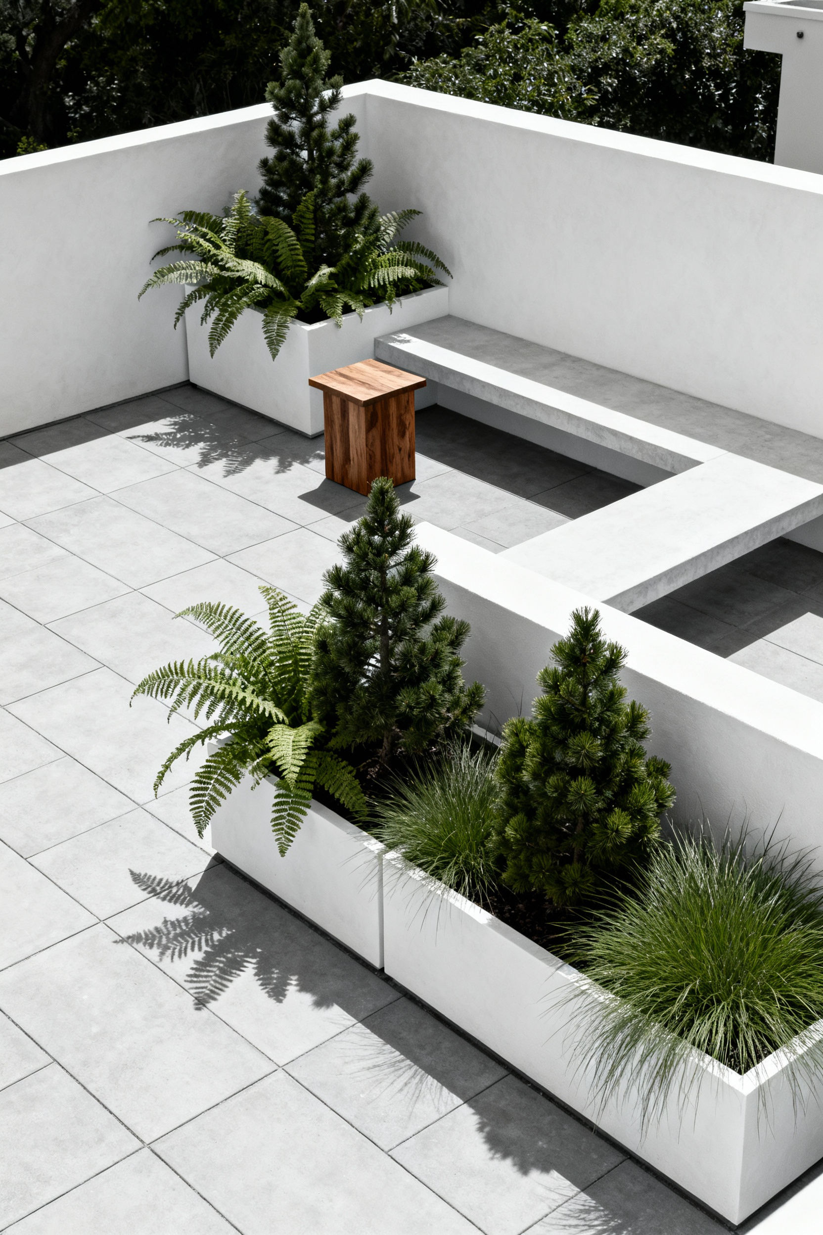 A minimalist Nordic patio featuring light gray polished concrete and crisp white walls, accented solely by deep green plants in geometric planters, illustrating a sustainable monochrome design palette.