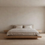 A minimalist luxury bedroom featuring a low-chroma palette of cream and taupe, designed to reduce visual and auditory noise for maximum restoration and calm.